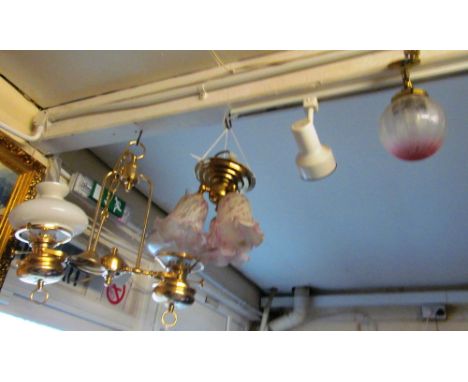 A pink etched small round ceiling light, ceiling light with three pink shades and a ceiling light with oil lamp style shades