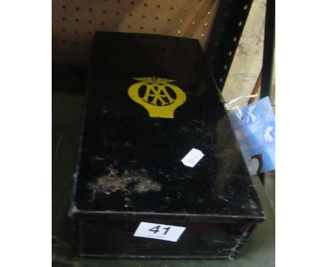 An AA First Aid tin, two AA badges, two bird car mascots, two car flags (Union and Royal Standard) and two Union flags on pol
