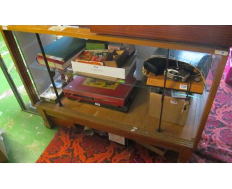 A shop/tailors unit with glass shelf (no sliding doors)