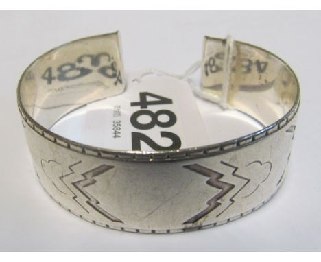 A Georg Jensen silver cuff bangle Aztec design, signed