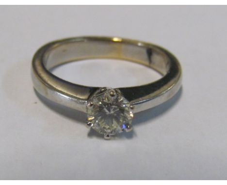 A solitaire diamond ring marked 750, size J/K 4.2g