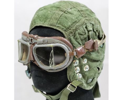 British WWII style flying helmet with goggles, damage to three of the four lenses. P&amp;P Group 1 (£14+VAT for the first lot