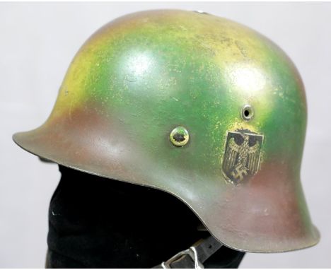 German WWII style helmet with liner and chinstrap. P&P Group 2 (£18+VAT for the first lot and £2+VAT for subsequent lots)Cond