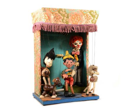 Pelham Puppet stage arrangement, including Pinocchio, Clown, Horse and Foal, Dog, electrified motor, height 54cm.