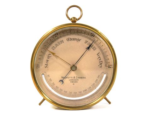 Brass cased desk top barometer, the dial signed Negretti &amp; Zambra, diameter 12cm.Condition report:Split  /air bubble in t