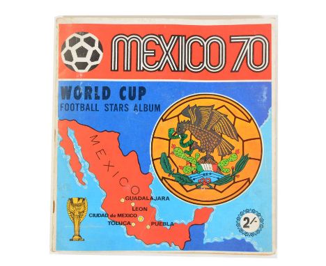A Mexico 1970 Panini sticker album, near complete with two self-adhesive stickers missing, the Rimet Cup and the Morocco Shie