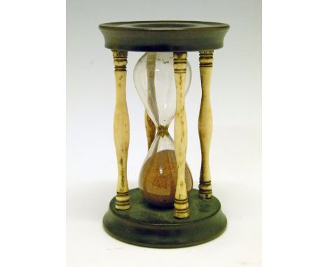19th Century turned hardwood and bone framed egg timer, 8.5cm high  Condition: One end has a split running approximately 10mm