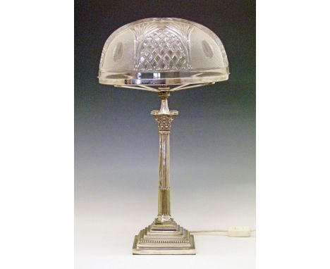 Silver plated Corinthian column table lamp having a fluted column, stepped base and with a large cut glass dome shaped shade,