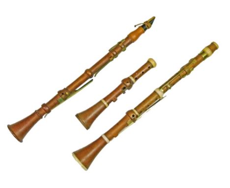 19th Century ivory banded boxwood clarinet by Thomas Key of London, 59cm long, another 19th Century boxwood clarinet by Butto