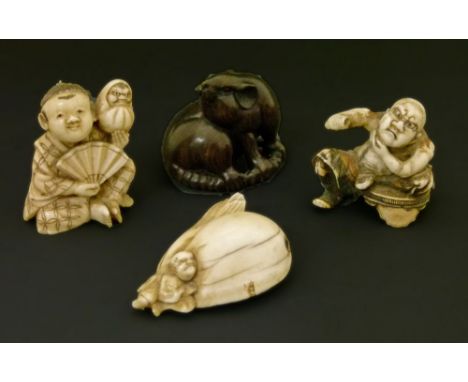 Three Japanese carved ivory netsuke, Meiji period, the first formed as a seated tattooed man shaving, signed Rantei, 3.25cm h