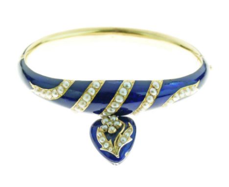 Mid Victorian pearl and enamel hinged bangle, the frontispiece with five split pearl set bands running diagonally, with a hea