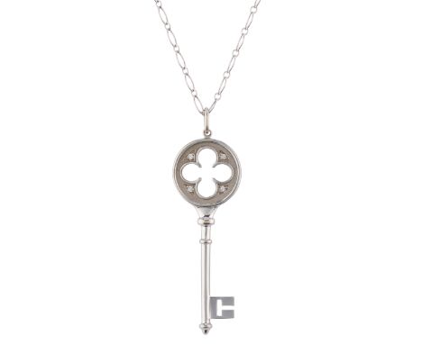 Tiffany & Co., an 18ct gold brilliant-cut diamond accent Quatrefoil Key pendant, suspended from a fancy-link chain, signed Ti