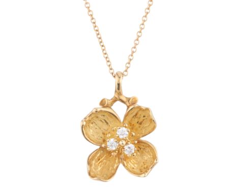 Tiffany & Co., a vintage 18ct gold brilliant-cut diamond Dogwood Flower pendant, suspended from a trace-link chain, estimated