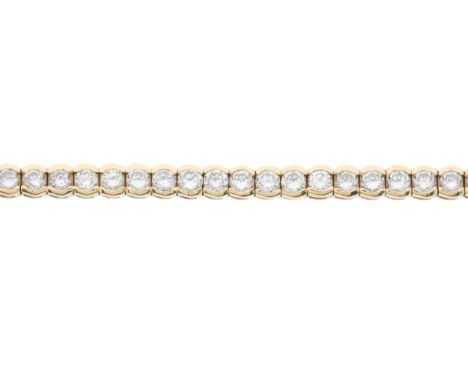 A 14ct gold brilliant-cut diamond line bracelet, with partially concealed push-piece clasp, estimated total diamond weight 12