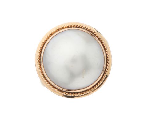 A 14ct gold mabe pearl single-stone ring, with rope-twist surround, band stamped K14, ring size N, 5.4gCondition- Overall goo