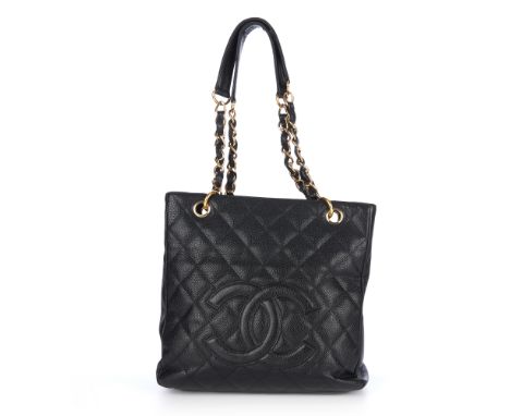 Chanel, a Petite Shopping Tote, crafted from grained black caviar leather with maker's classic diamond quilting and large emb