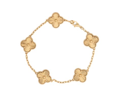 Van Cleef & Arpels, an 18ct gold Vintage Alhambra 5 motifs bracelet, designed as a series of five quatrefoil panels, with con
