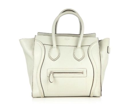 Celine, a Mini Luggage tote, designed with a grained grey leather exterior, featuring expandable leather side wings, a front 