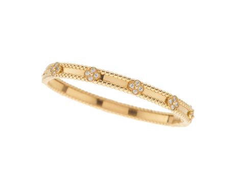 Van Cleef & Arpels, an 18ct gold diamond Perlee Sweet Clovers bangle bracelet, total diamond weight 0.69ct, estimated G+ colo