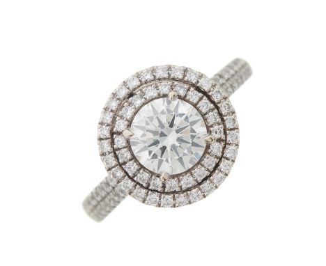 An 18ct gold brilliant-cut diamond single-stone ring, with similarly-cut diamond double surround and diamond line shoulders, 