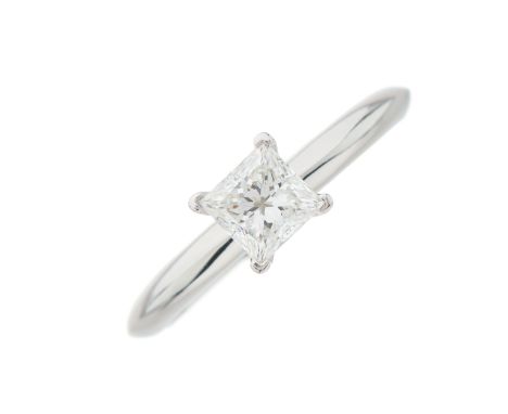 Tiffany & Co., a platinum square-shape diamond single-stone ring, with knife-edge band, with report from Tiffany & Co. statin