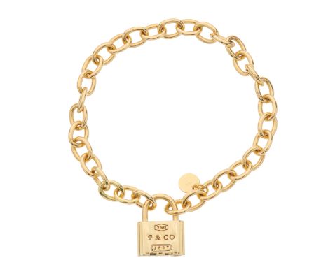 Tiffany & Co., an 18ct gold 1837 Padlock Charm bracelet, signed Tiffany & Co., stamped 750, length 19cm, 29.4gCondition- Over