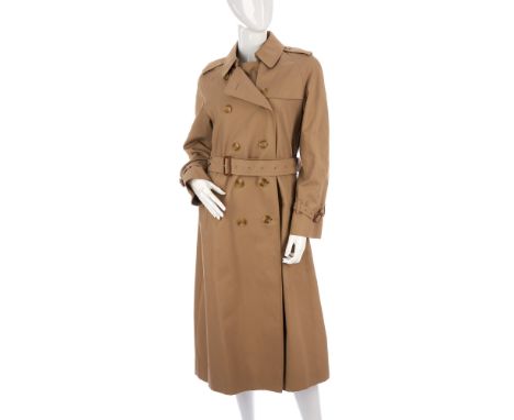Burberry, a ladies classic trench coat, designed with a notched lapel collar, buttoned epaulettes, deep back yoke, double bre