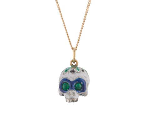 A silver circular-shape ruby accent vari-hue enamel skull pendant, with emerald cabochon eyes and 18ct gold surmount, suspend