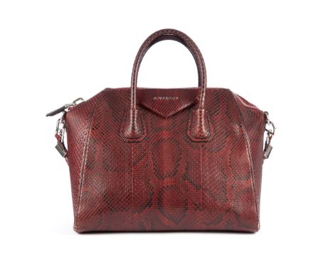 Givenchy, an Antigona handbag, designed with a burgundy python skin exterior, with a triangular patch featuring the maker's l