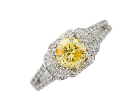 A 14ct gold Fancy Vivid Yellow diamond single-stone ring, with colourless diamond surround, gallery and shoulders, with repor