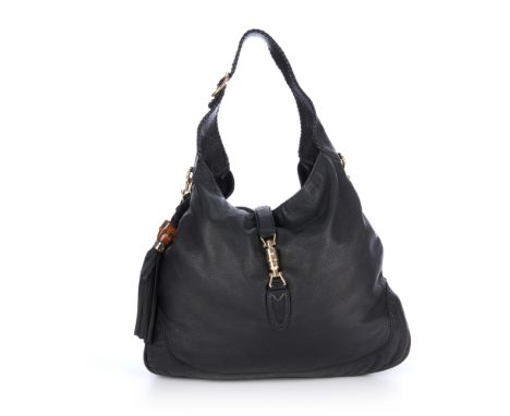 Gucci, a large black leather Jackie hobo handbag, designed with a grained black leather exterior, with a flat leather handle,