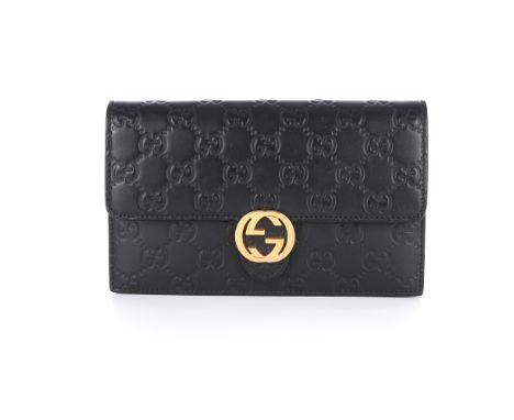 Gucci, a Guccissima Wallet On Chain handbag, designed with the maker's monogram embossed black leather exterior, with polishe