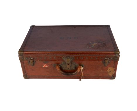 Louis Vuitton, a small early 20th century brown trunk, featuring the maker's logo stamped leather trim, with a leather top ha