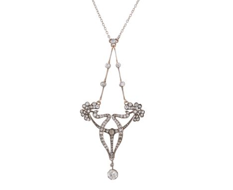 An Art Nouveau gold and silver, old-cut diamond foliate pendant, with similarly-cut diamond accent knife-edge surmount, suspe