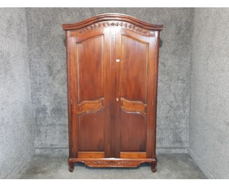 A Chinese hardwood wardrobe opening to reveal hanging space and shelf 121 x 203 x 59cm