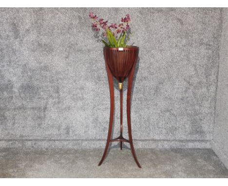 An empire style mahogany jardinere raised on tripod legs 119cm high.