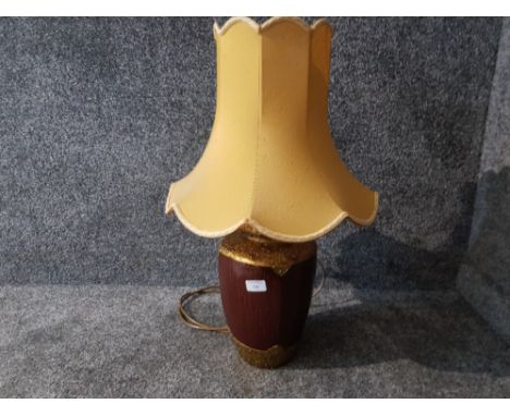 A pottery table lamp with gold coloured shade 67cm high including shade.