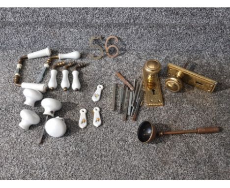 Brass and ceramic door handles, three escutcheons etc.