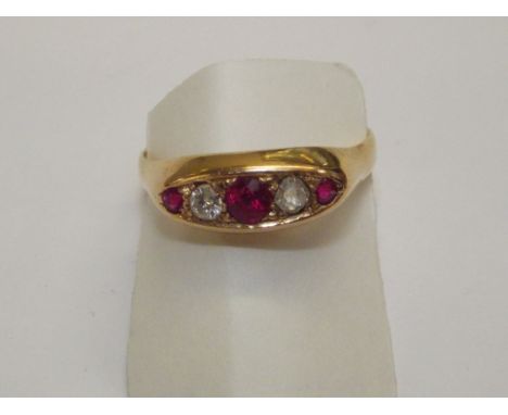 5 Stone diamond and ruby ring set in 18ct yellow gold band. Size Q