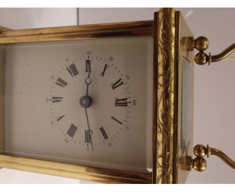 English Brass Carriage Clock, currently ticking. Height 12cm.