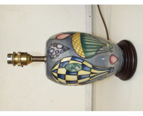 Moorcroft table lamp tube lined depicting various hot air balloons, height 29cm