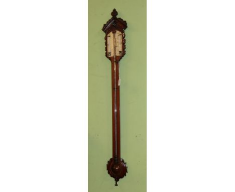 A Victorian mahogany Gothic style stick barometer, single ivory scale dial signed Hele Teignmouth