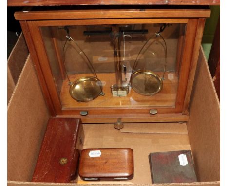 A cased set of scales, by Philip Harris Ltd, Birmingham; together with three cased sets of weights; and a set of 'U.S. Standa