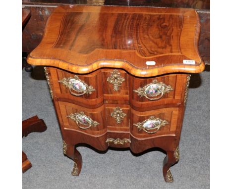 A 20th century French style two drawer commode, with porcelain and gilt metal handles, 62cm wide 