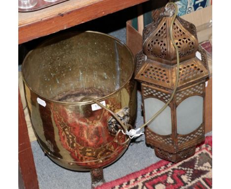 A brass coal bin with lion mask handles, an Indian lamp and a reproduction tapestry 
