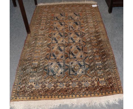 Afghan 'Gold' rug, the compartmentalised field of guls enclosed by multiple borders, 187cm by 111cm