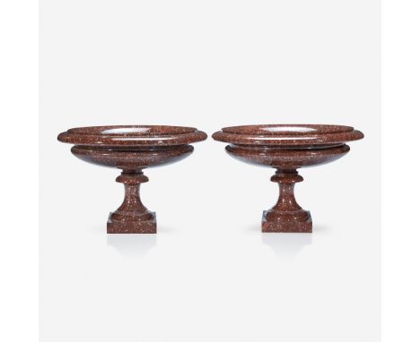 A fine pair of Continental porphyry tazza 19th century Shallow circular form, raised on socle and conforming plinth. (2).H: 9