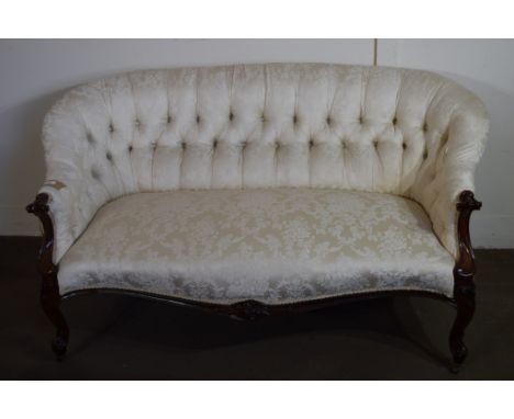 19TH CENTURY MAHOGANY FRAMED BUTTON BACK SOFA IN THE ROCOCO STYLE, RAISED ON CARVED LEGS OVER CASTERS, WIDTH APPROX 146CM MAX