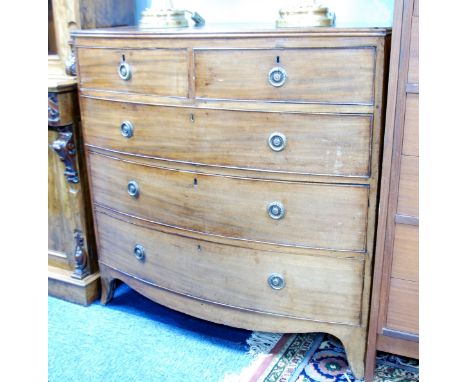 EARLY 19TH CENTURY MAHOGANY BOW FRONTED CHEST OF DRAWERS, the shaped top with later side pieces above two short and three lon
