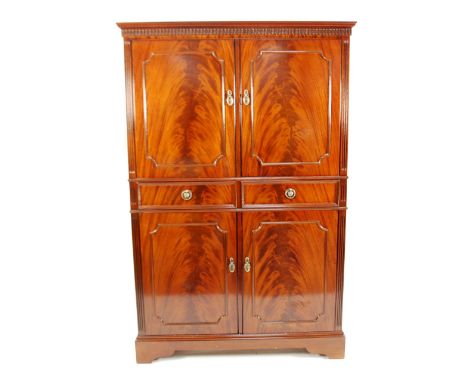 GEORGIAN STYLE MODERN REPRODUCTION FLAME CUT MAHOGANY DRINKS CABINET, the moulded cornice above a pair of panelled cupboard d